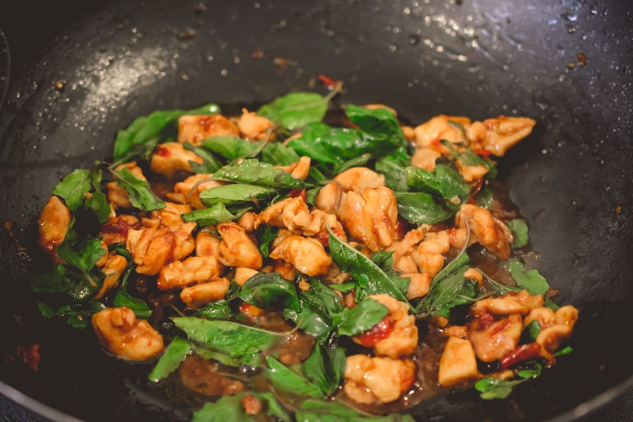 Stir Fried Basil Chicken on wooden, Thai Famous Food